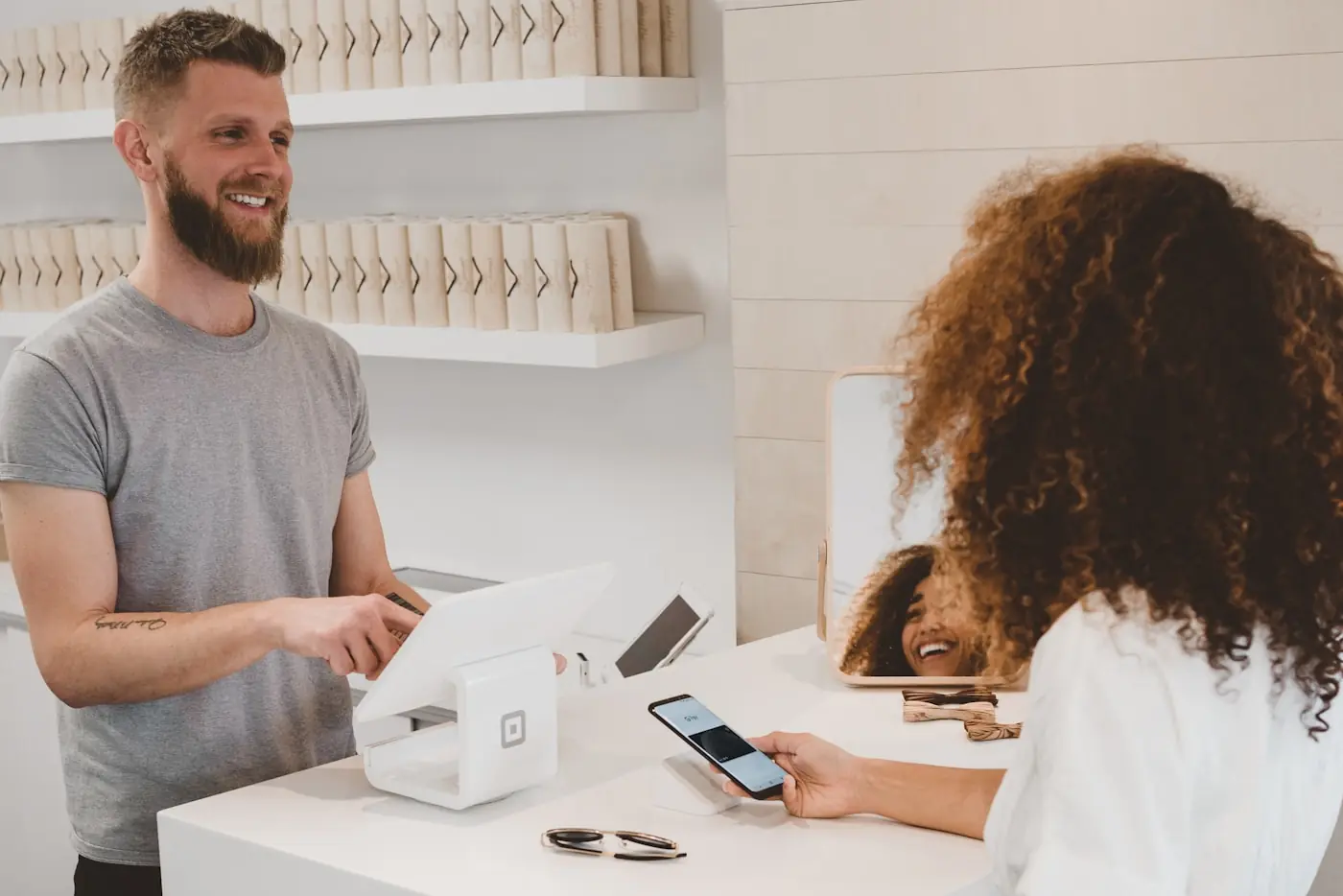 Person browsing products on a phone in a retail setting