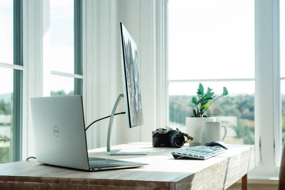 Modern workspace with multiple screens displaying campaign data